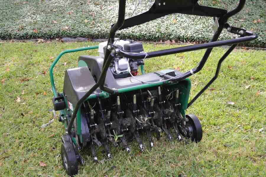 Lawn aerator machine on grass