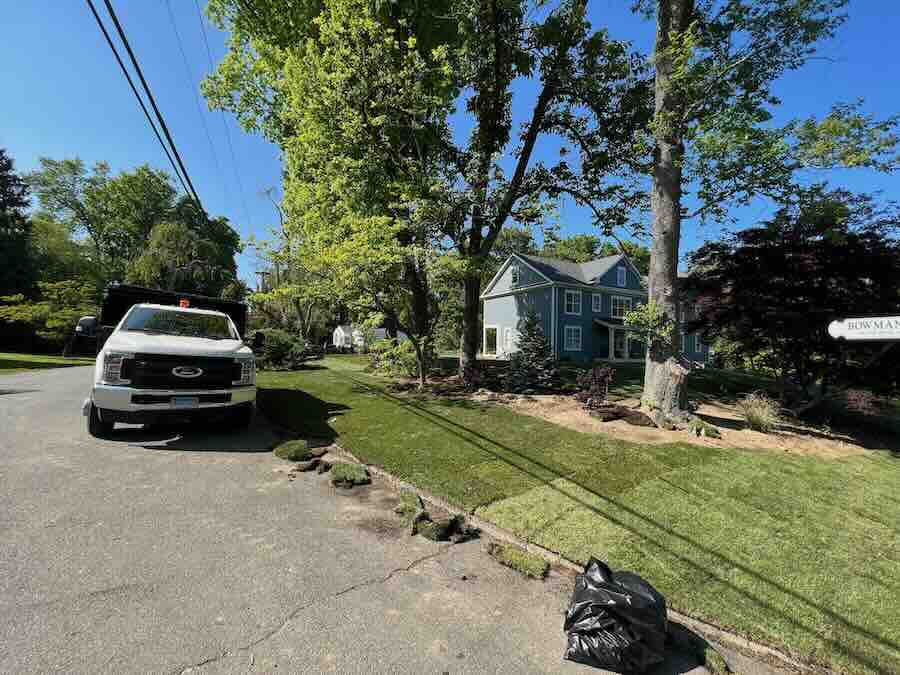 Truck parked on suburban street near house.