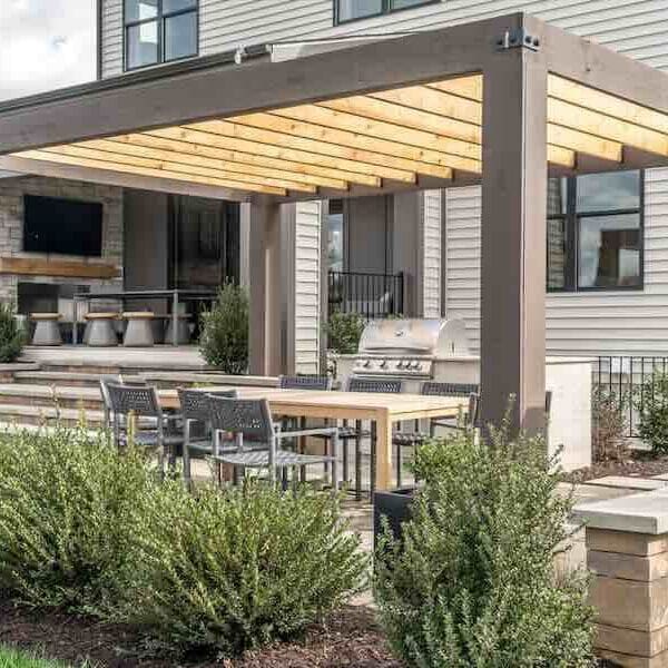Modern patio with pergola and outdoor seating area.